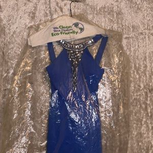 Beautiful dress with rhinestones embellishments giving it that perfect flare.